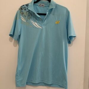 Yonox light blue polo shirt with design on shoulder and yellow embroidery. 2XL